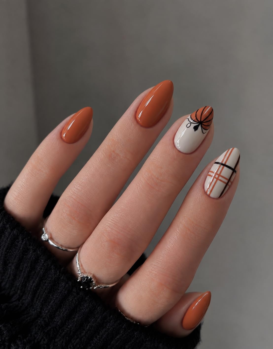 image:imageUNA GELLA Halloween Press On Nails Short Almond 32Pcs Pumpkin Fake Nails Soft Gel Nail Tips Almond Shape in 16 Sizes with Semi Glue and Jelly Tabs Orange Glitter Finish for Party Fall ManicuresHallowween Plaid Short Almond