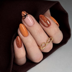 UNA GELLA Halloween Press On Nails Short Almond, 32Pcs Pumpkin Fake Nails Soft Gel Nail Tips Almond Shape in 16 Sizes with Semi Glue and Jelly Tabs, Orange Glitter Finish for Party Fall Manicures(Hallowween Glitter Short Almond)